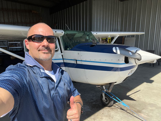Man next to plane